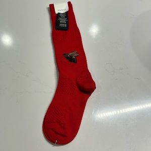Gucci red socks with embroidered bee.